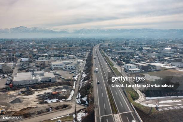 snowcapped tateyama mountains and toyama city in toyama prefecture of japan aerial view from airplane - toyama prefecture 個照片及圖片檔