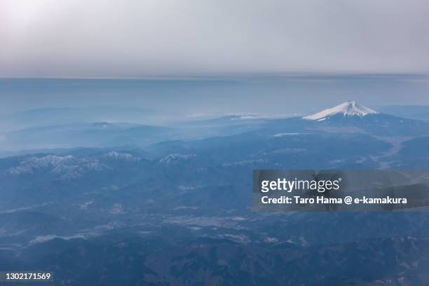 snowcapped mt. fuji and in japan aerial view from airplane - prefettura di shizuoka foto e immagini stock