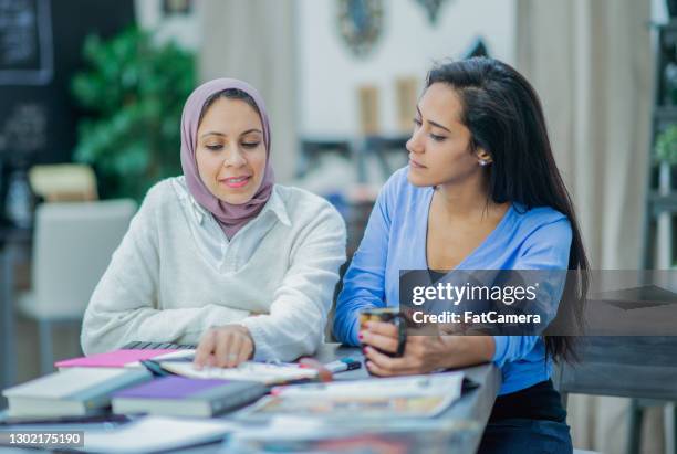 female entrepreneurs working together on a business strategy - showus office stock pictures, royalty-free photos & images