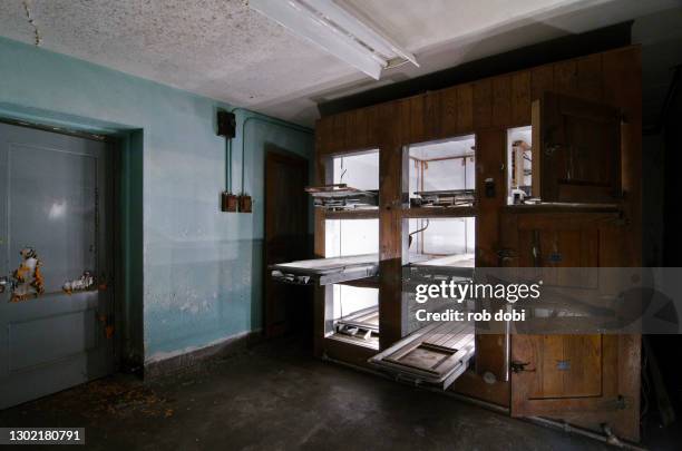 morgue drawers inside abandoned mental asylum - morgue ストックフォトと画像
