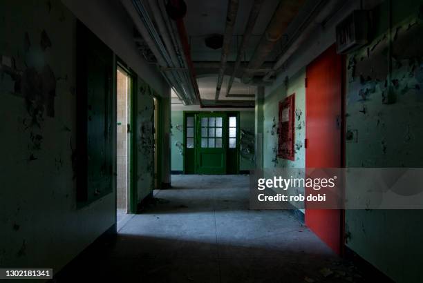 interior basement hallway inside abandoned mental asylum - cave floor imagens e fotografias de stock