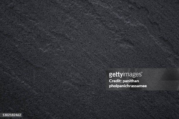 macro shot of granite surface. - color negro fotografías e imágenes de stock