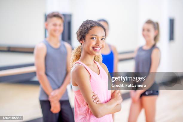 teenage girl in a yoga studio with friends - ymca stock pictures, royalty-free photos & images