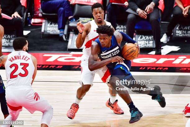 Anthony Edwards of the Minnesota Timberwolves drives to the basket past Kyle Lowry of the Toronto Raptors during the second at Amalie Arena on...