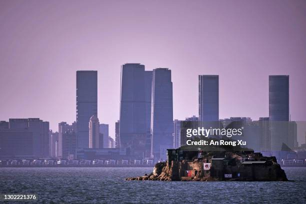 An Island that lies inside Taiwan's territory is seen with the Chinese city of Xiamen in the background on February 04, 2021 off the coast of Lieyu,...