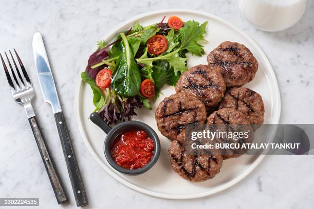 grilled meatballs with green salad - turkey meat balls stock pictures, royalty-free photos & images