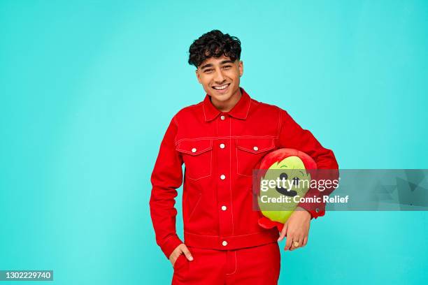 Television presenter, Karim Zeroual holding Red Nose Day 2021 merchandise on October 23,2020 in London, England. Red Nose Day takes place on March...