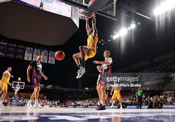 Matt Kenyon of the Brisbane Bullets dunks during the round five NBL match between the Adelaide 36ers and the Brisbane Bullets at Adelaide...
