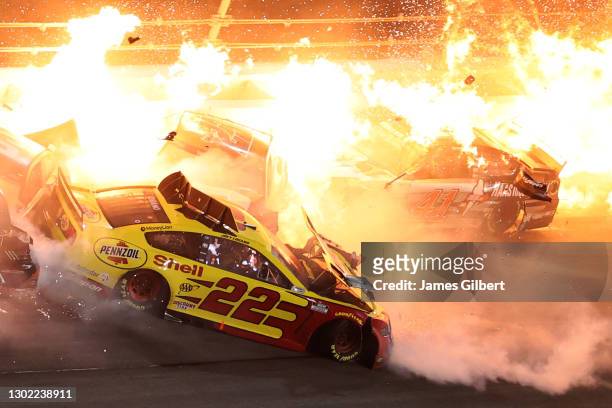Joey Logano, driver of the Shell Pennzoil Ford, and Cole Custer, driver of the HaasTooling.com Ford, are involved in an on-track incident during the...
