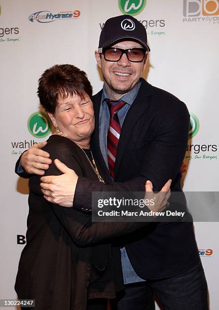 Alma Elaine Wahlberg and her son, Donnie Wahlberg attend the grand opening of Wahlburgers on October 24, 2011 at the Hingham Shipyard in Boston,...