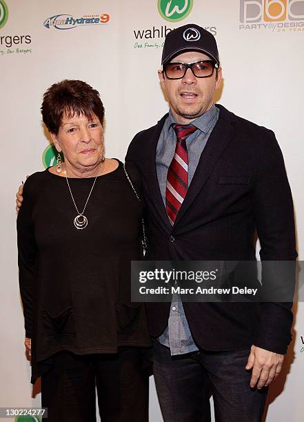 Alma Elaine Wahlberg and her son, Donnie Wahlberg attend the grand opening of Wahlburgers on October 24, 2011 at the Hingham Shipyard in Boston,...