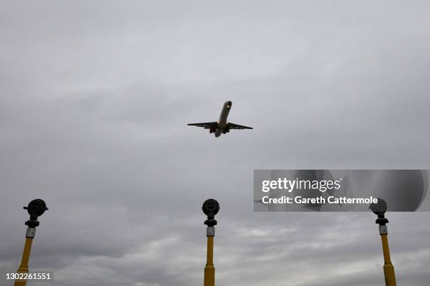 An aircraft lands at Stansted Airport on February 14, 2021 in Stansted, United Kingdom.