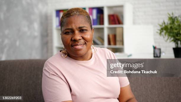 obese african-american lady with short hair - voluptuous black women stock pictures, royalty-free photos & images