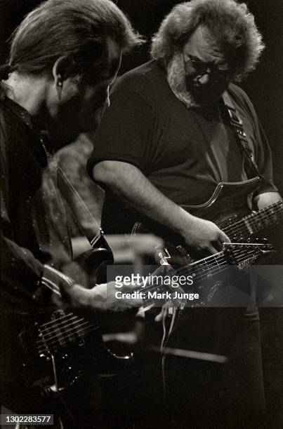 Musicians Bob Weir and Jerry Garcia of the Grateful Dead perform at McNichols Sports Arena on December 13, 1990 in Denver, Colorado. Garcia was the...