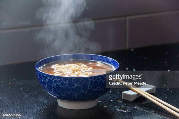 a steaming bowl of instant noodles - ramen noodles stock pictures, royalty-free photos & images