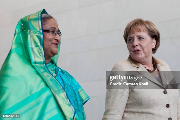 Sheikh Hasina Wajed , Bangladesh's prime minister, talks to German Chancellor Angela Merkel after a press conference at the Chancellory on October...