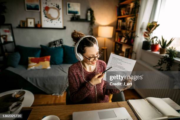 smiling young woman teaching online. - online demonstration stock pictures, royalty-free photos & images