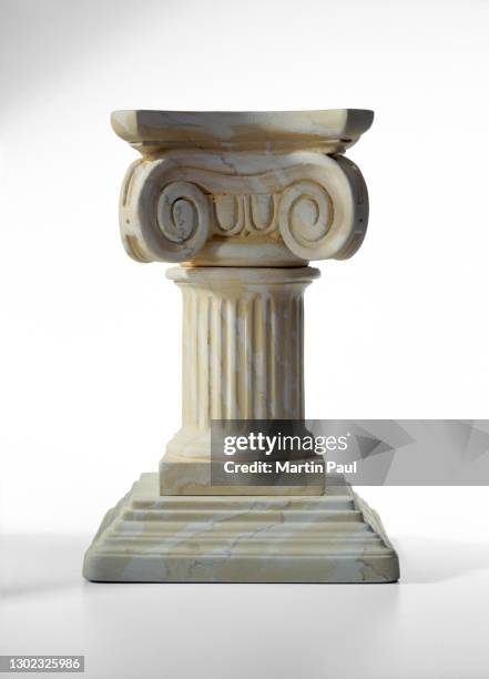 ancient greek pedestal column isolated on white background - pedestal stock pictures, royalty-free photos & images