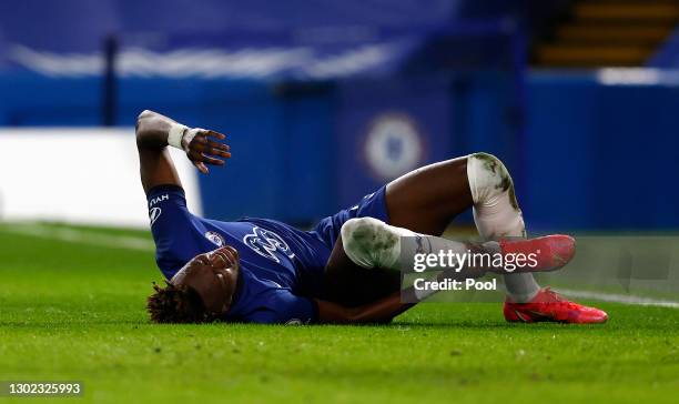 Tammy Abraham of Chelsea reacts after a collision leading to him going off injured during the Premier League match between Chelsea and Newcastle...