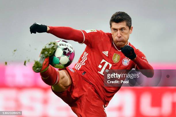 Robert Lewandowski of FC Bayern Muenchen scores their team's first goal during the Bundesliga match between FC Bayern Muenchen and DSC Arminia...