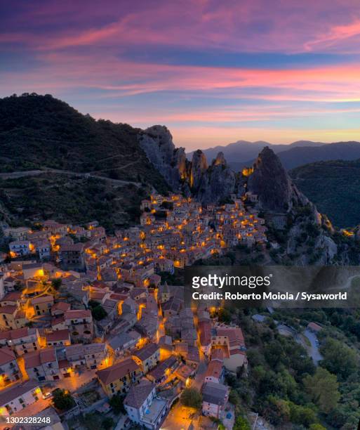 illuminated castelmazzano old town at dawn, basilicata, italy - romantic sky stock pictures, royalty-free photos & images
