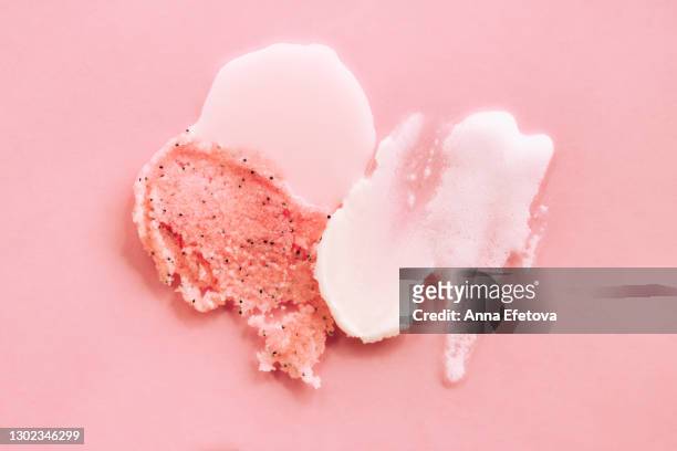 set of abstract smears of shower gel, cream and scrub on pink background. trendy products of the year. health and wellness concept - body scrub bildbanksfoton och bilder