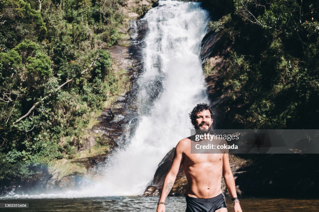 Man at waterfall