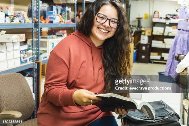 Generation Z Female College Student Taking a Break at Work in Warehouse to Study Photo Series
