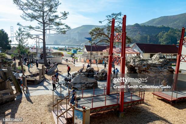 High-angle shot of the Lookout Cove at the Bay Area Discovery Museum, with the Golden Gate Bridge and hills visible in the background, in Sausalito,...