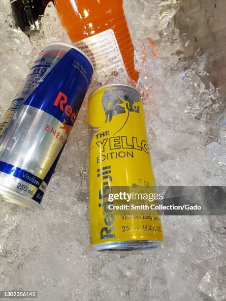 Close-up of cans of the energy drink Red Bull and Red Bull Yellow Edition on ice, in Walnut Creek, California, February 7, 2021.