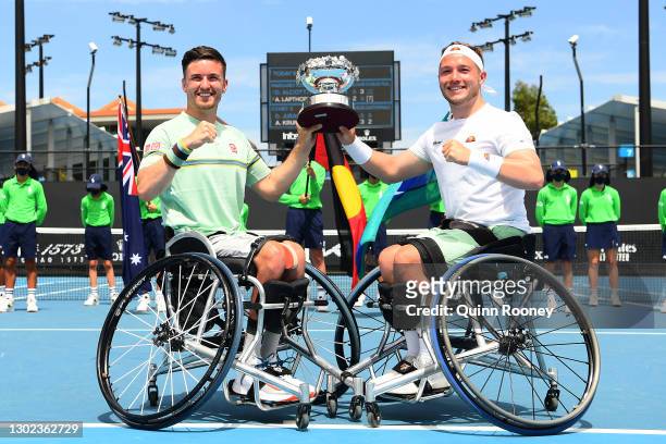 Gordon Reid of Great Britain and Alfie Hewett of Great Britain pose with the championship trophy after winning the Men's Wheelchair Doubles Final...