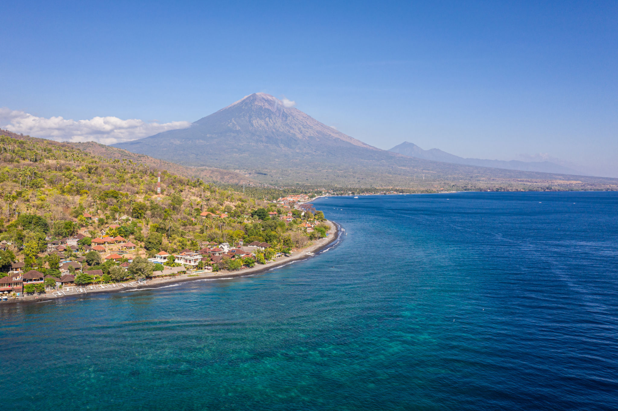 Bali north coast in the Amed area with Agung volcano in the background Bali north coast in the Amed area with Agung volcano in the background