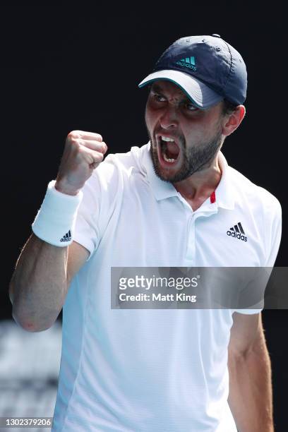 Aslan Karatsev of Russia celebrates after winning a point in his Men's Singles Quarterfinals match against Grigor Dimitrov of Bulgaria during day...