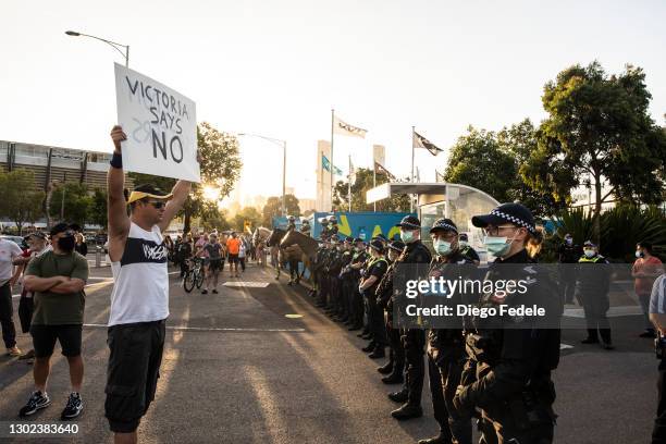 Anti lockdown protesters gather in front of the Rod Lavern Arena, following the announce of the lockdown on February 12, 2021 in Melbourne,...