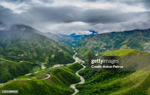 aerial view of the valley in north yungas, bolivia. rain season - steil stockfoto's en -beelden