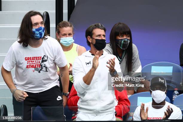 Alexis Ohanian, Patrick Mouratoglou, Jarmere Jenkins and Venus Williams watch the Women's Singles Quarterfinals match between Simona Halep of Romania...