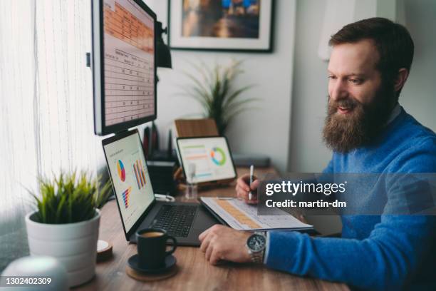 man working at home talks to virtual assistant - financial analyst stock pictures, royalty-free photos & images