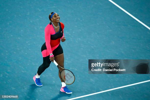 Serena Williams of the United States celebrates winning match point in her Women's Singles Quarterfinals match against Simona Halep of Romania during...
