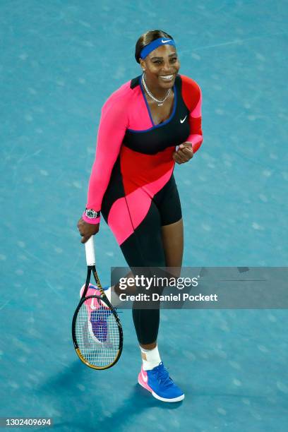Serena Williams of the United States celebrates winning match point in her Women's Singles Quarterfinals match against Simona Halep of Romania during...