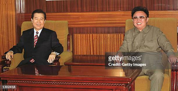 South Korean President Kim Dae-jung, left, and North Korean leader Kim Jong Il laugh during a meeting in Pyongyang June 15, 2000. The South Korean...