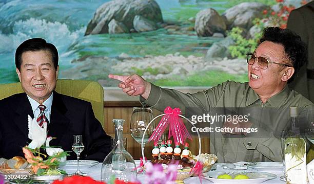 South Korean President Kim Dae-jung, left, and North Korean leader Kim Jong Il share a laugh at a luncheon June 15, 2000 held in Pyongyang, North...