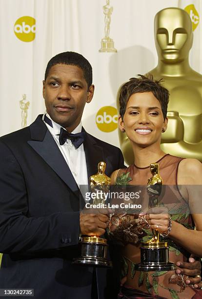 Best Actor and Actress winners Halle Berry and Denzel Washington pose with their Oscars backstage