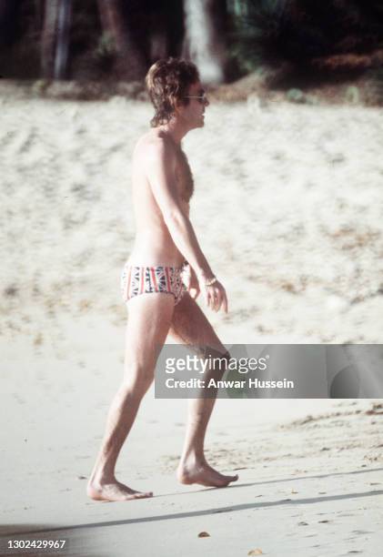 Roddy Llewellyn, Princess Margaret's boyfriend, walks along the beach wearing Union Jack swimming trunks while on holiday in the island of Mustique...