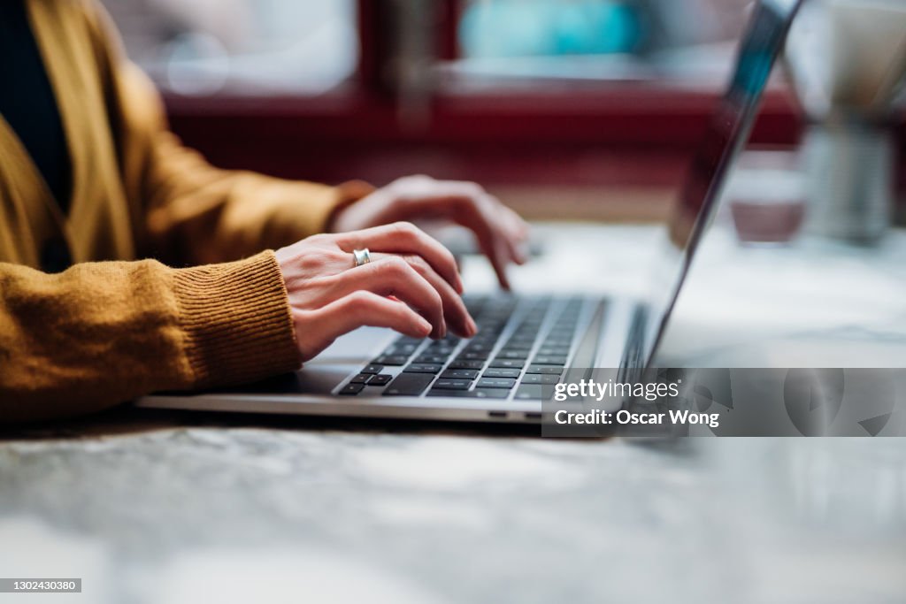 Closeup Shot Of An Unrecognizable Woman Using Laptop