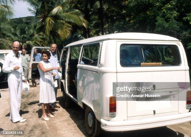 Princess Margaret points to the combi for The Queen to enter a combi vehicle during the Queen and Prince Philip's visit to Mustique in 1977 in...