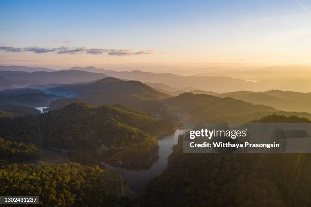 beautiful sunshine at misty morning mountains - aerial jungle stock-fotos und bilder