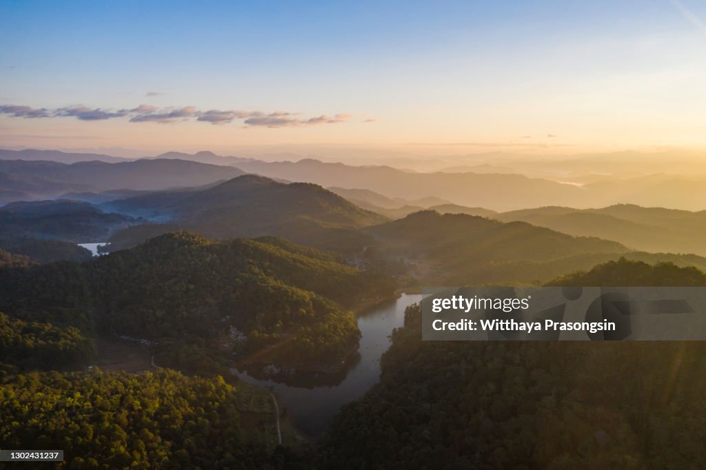 Beautiful sunshine at misty morning mountains