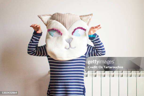 girl playing at home witha handmade cat face cushion - cat costume stock pictures, royalty-free photos & images
