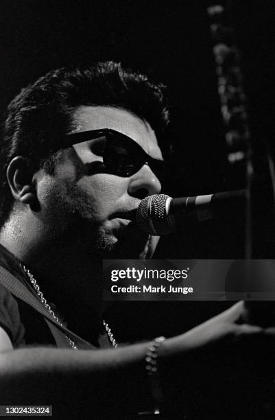 Cesar Rosas sings and plays guitar in a Los Lobos concert at the Paramount Theatre on November 5, 1987 in Denver, Colorado. Los Lobos is an American...