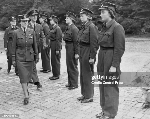 Princess Alice, Duchess of Gloucester and Air Commandant of the Women's Auxiliary Air Force inspects members of an anti aircraft defence barrage...